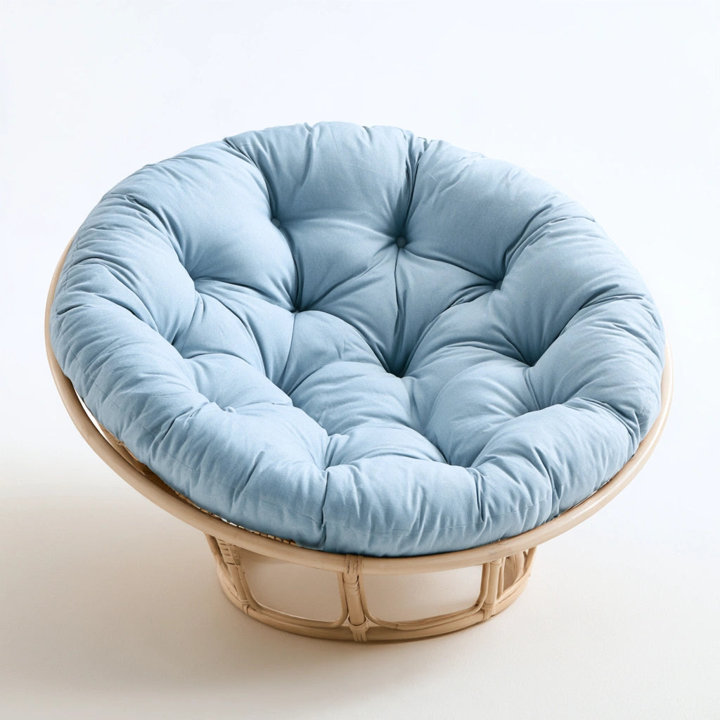 Fauteuil papasan aux lignes épurées, coloris bleu clair